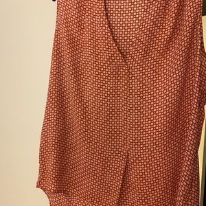 Pink and red polka dotted sleeveless blouse